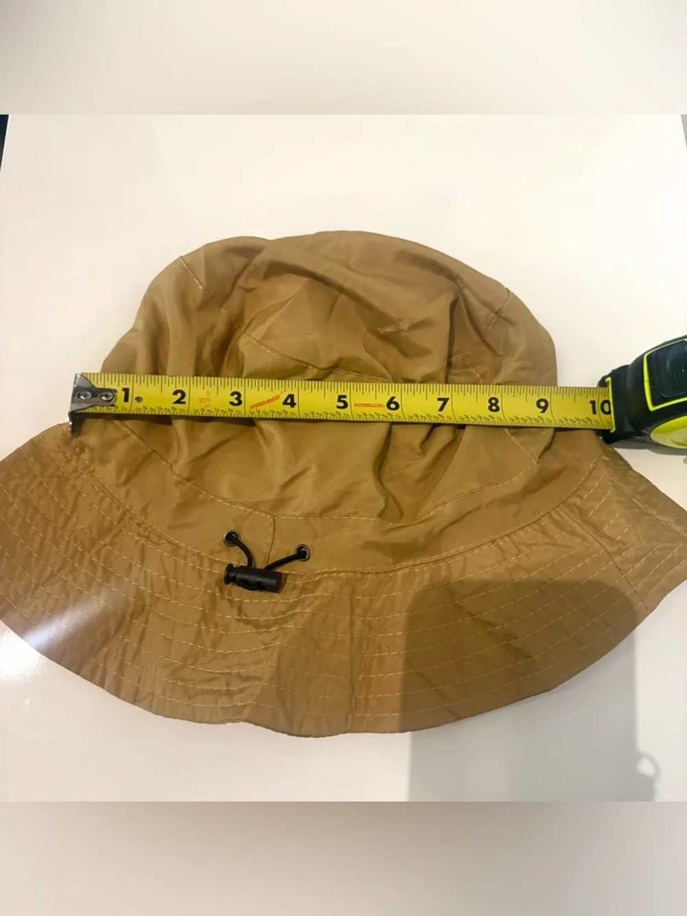 Lightweight Brown Bucket Hat with Red-Orange Wave Detail Never used